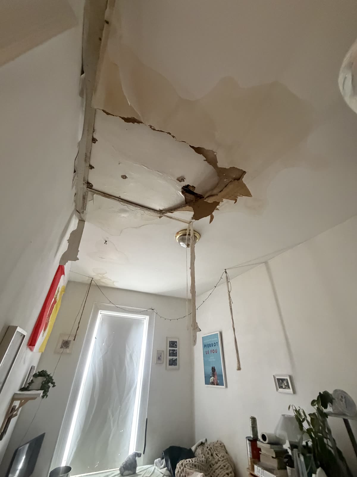 Water damage and stained ceiling reported by tenant